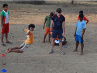 Head of Coaching, Cormac Whelan (central), oversees the standing long jump during testing phase surrounded by more student athletes.